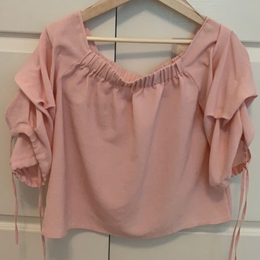pink off shoulder blouse with puff sleeves